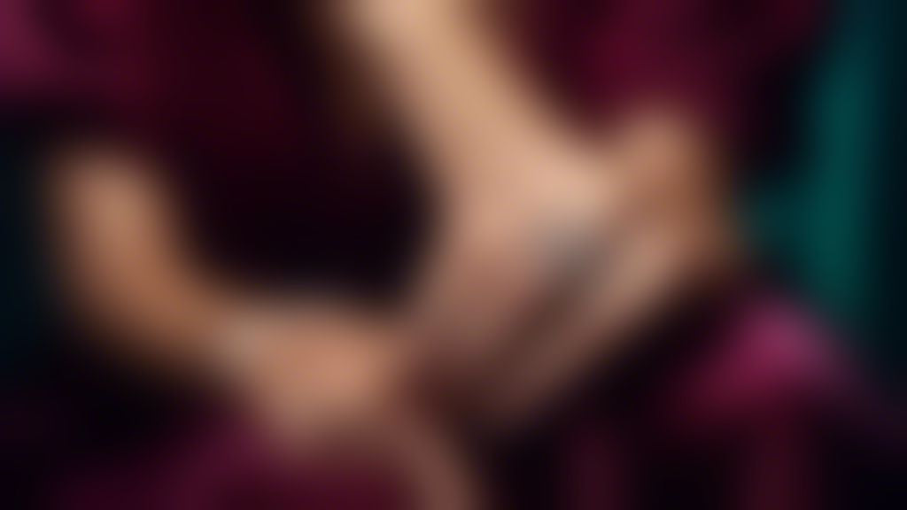 A close-up, highly detailed image of slender, elegant hands adorned with sparkling diamond stackable rings, showcasing their brilliance against a luxurious, softly lit, velvet background.